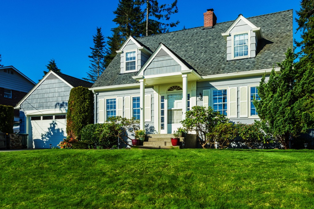 Charming house with green lawn.
