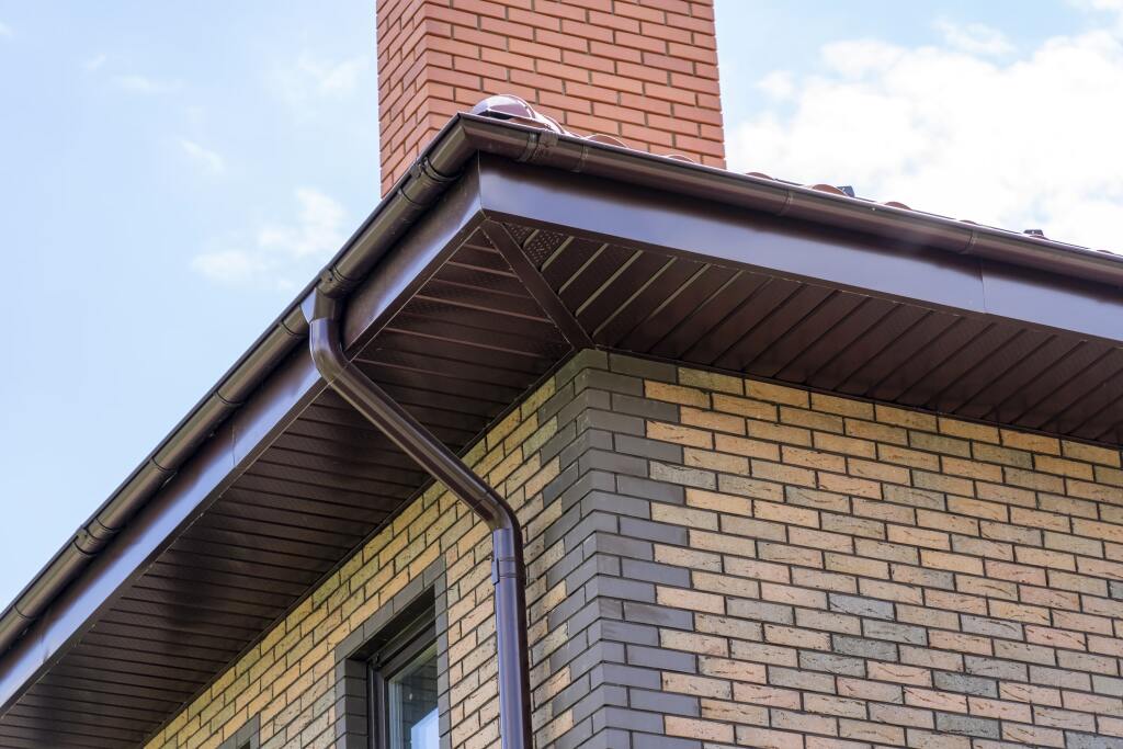 Brick home with brown guttering system