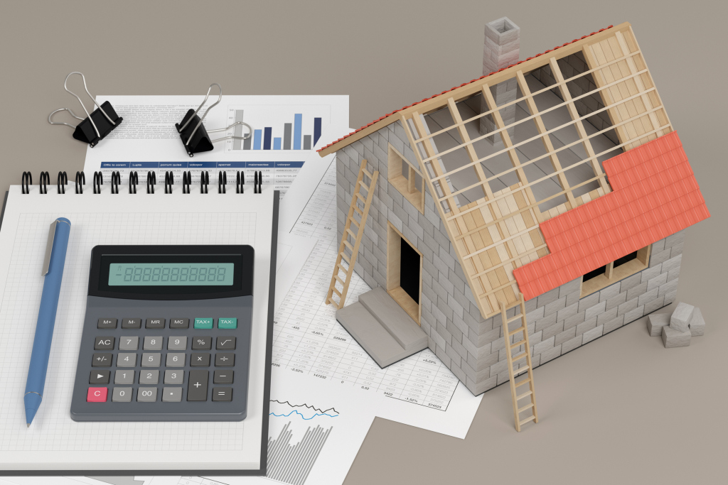 Calculator and house model on documents