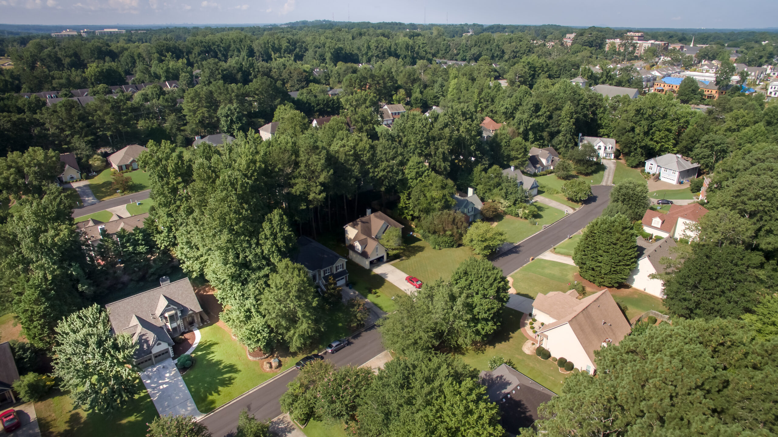Aerial view of suburban neighborhood with trees.