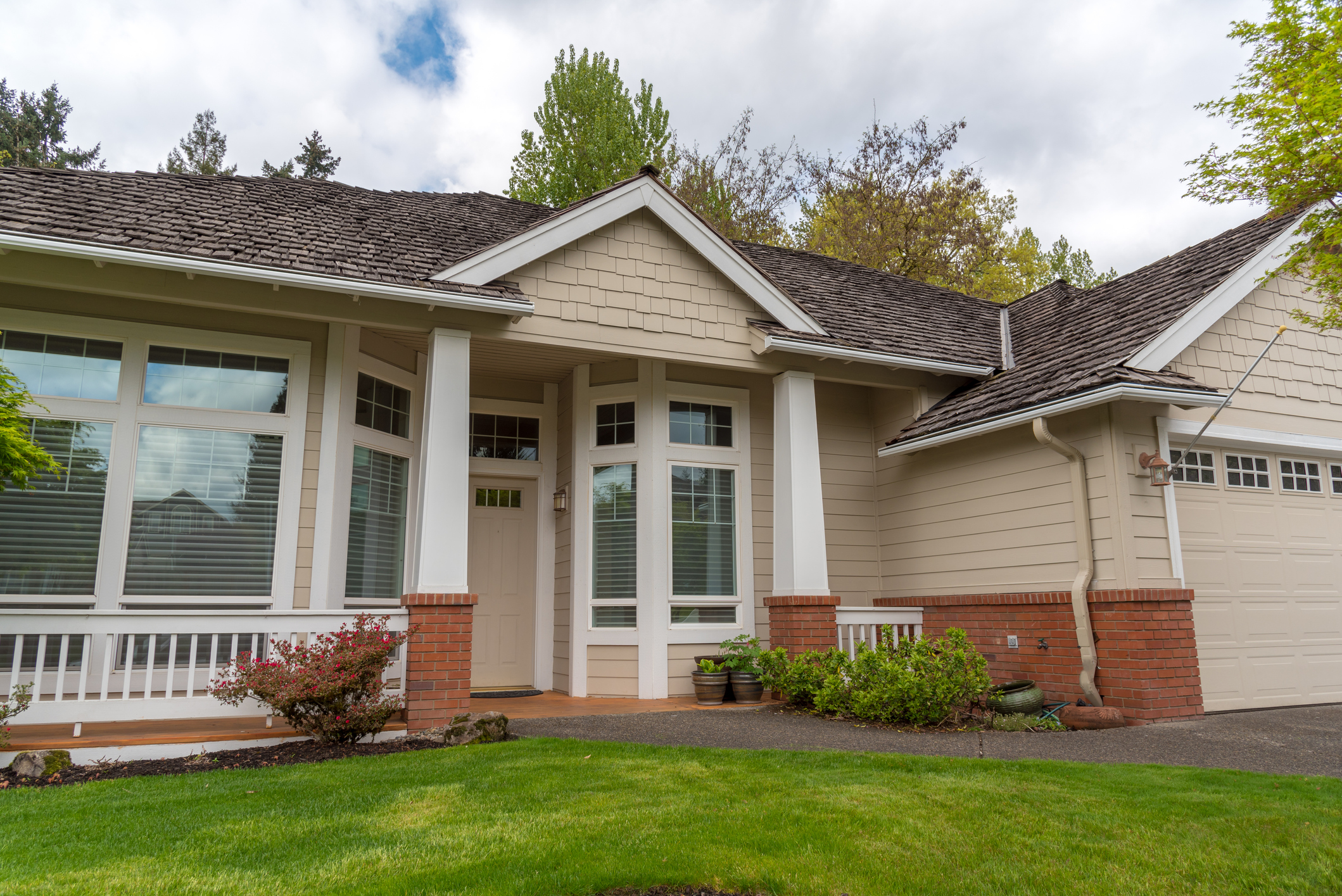 Beautiful suburban house with a front yard and brick accents