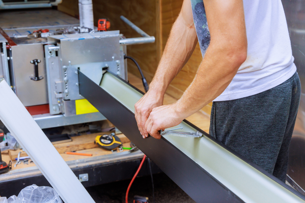 Man assembling equipment in workshop