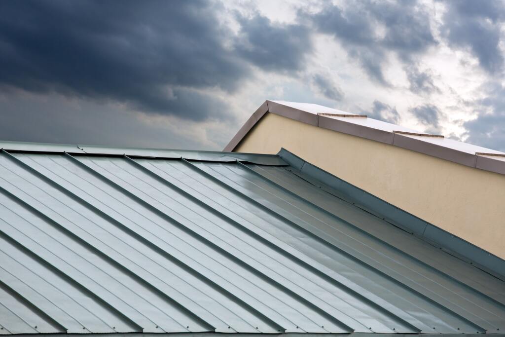 Metal roofs under cloudy sky