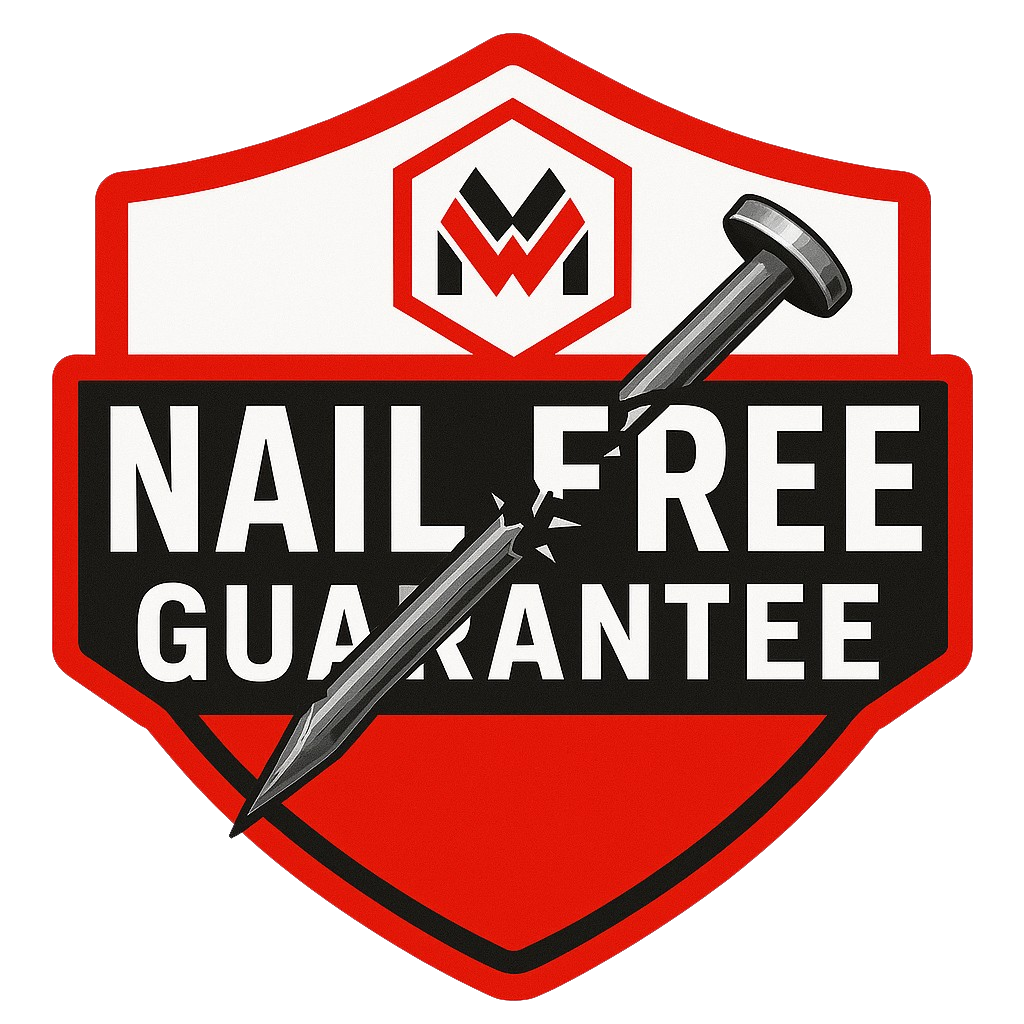 Nail Free Guarantee shield logo with hammer and nail design in red and black