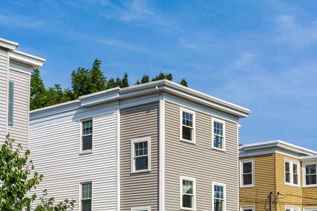 Modern homes with flat roofs and greenery
