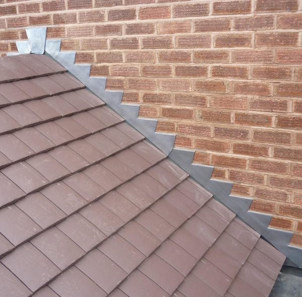 Roof with brick wall background.